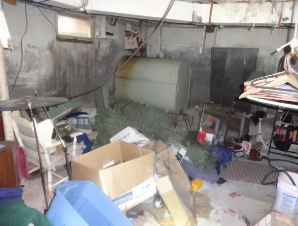Cluttered basement in need of junk removal